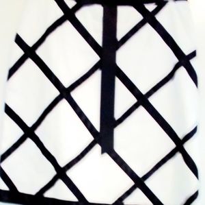 Skirt with satin bow in front and satin ribbon as stripes